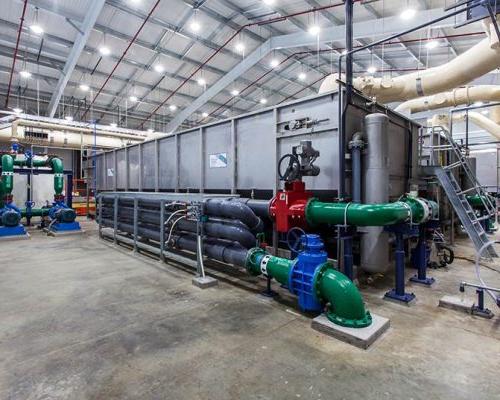 Piping, clarifier, and other mechanical equipment inside the facility